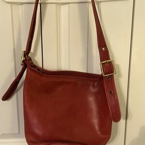 Rust color Coach shoulder bag.